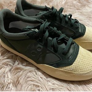 Green and cream athletic shoes